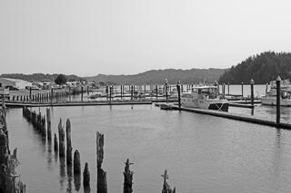 Siuslaw River and wood posts Florence Oregon