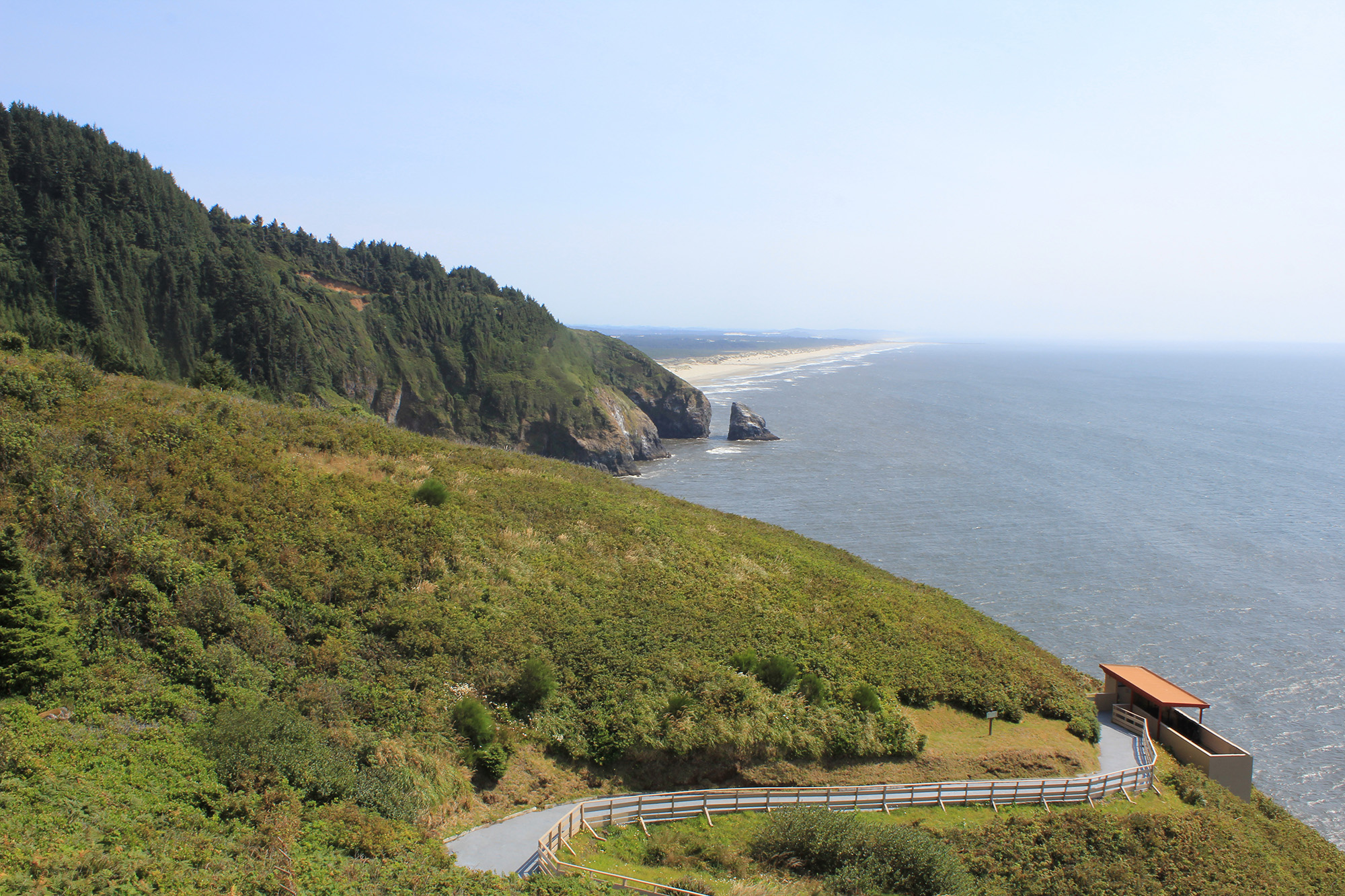 Viewpoint Devils Elbow State Park Oregon Coast Devil’s Elbow State Park on the Oregon Coast, with Heceta Head rising above the rugged shoreline and Pacific Ocean waves.